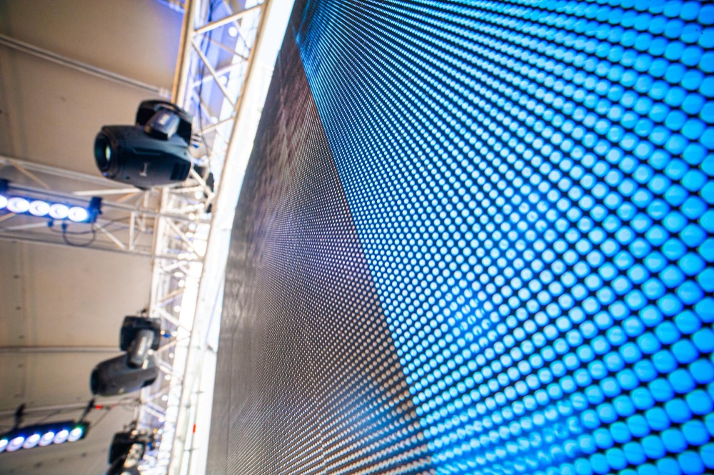 Close-up of LED wall pixels and modules with moving head lights on truss